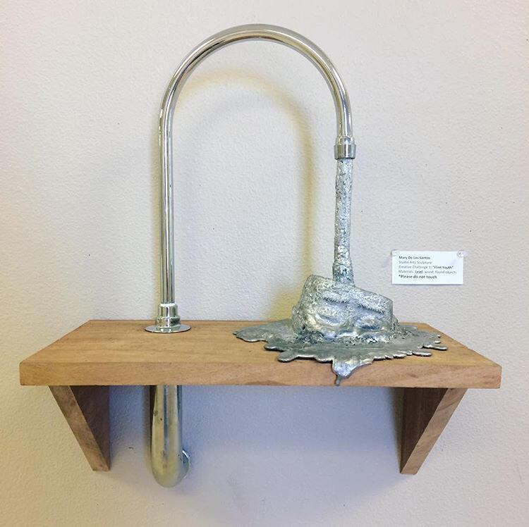 "Flint Youth" The head was casted in lead, found objects used. Flint Michigan has found lead in their drinking water. This highly effects children, causing damage to the brain and nervous system.